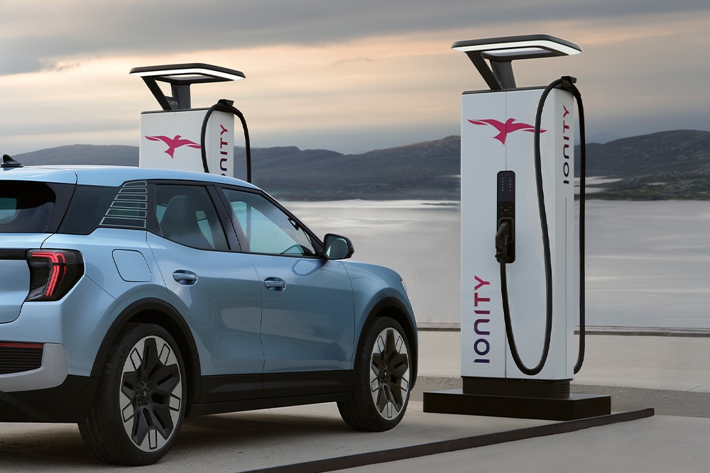 The electric Ford Explorer parked next to an IONITY EV charging station.