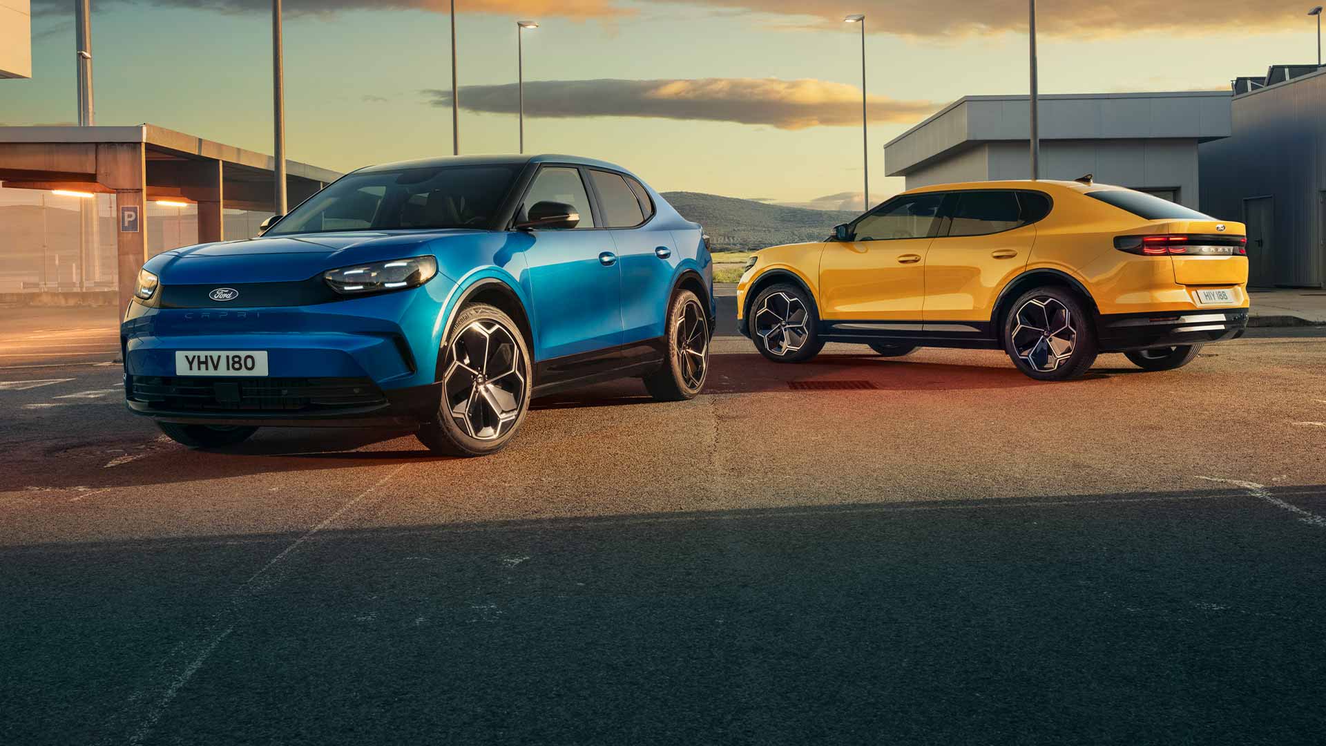 A blue and a yellow electric Ford Capri® parked together on a street.