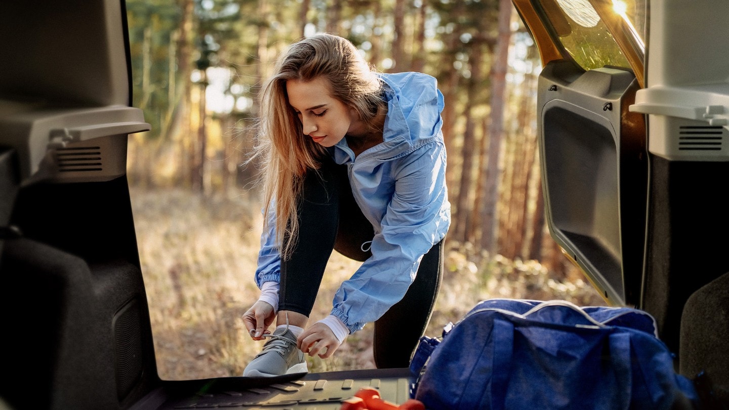 A woman tying shoelaces